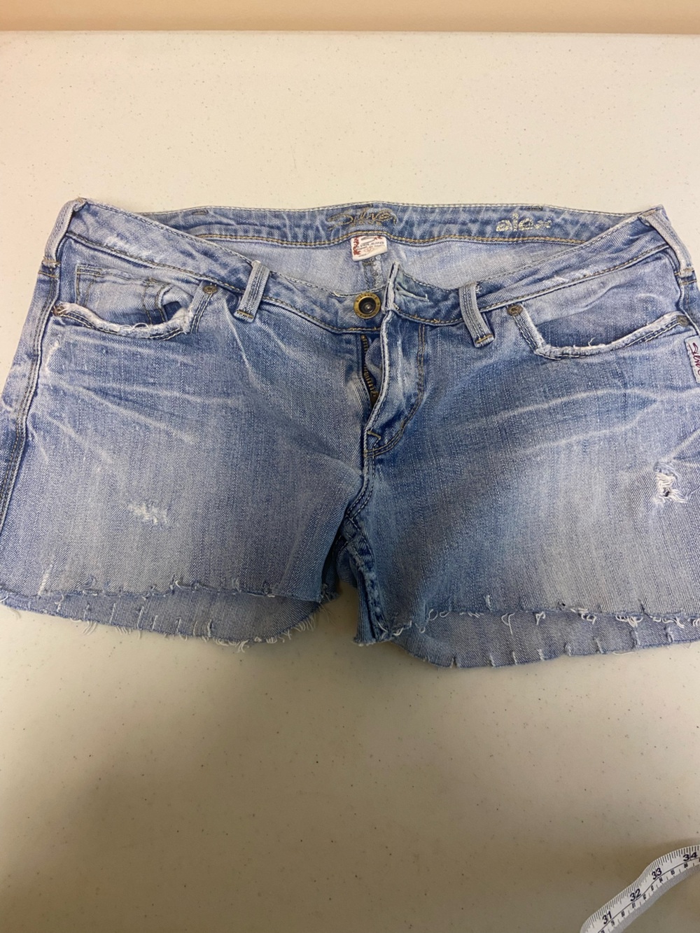 Light Wash Distressed Denim Cutoff Shorts